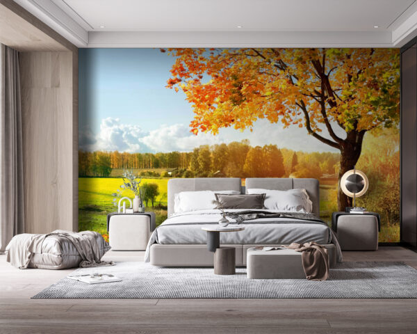 Fototapeta Drzewo z pomarańczowymi liśćmi na polu