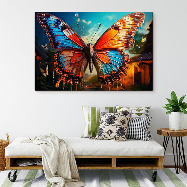 Motyl z pomarańczowymi i niebieskimi skrzydłami Obraz Motyl z pomarańczowymi i niebieskimi skrzydłami